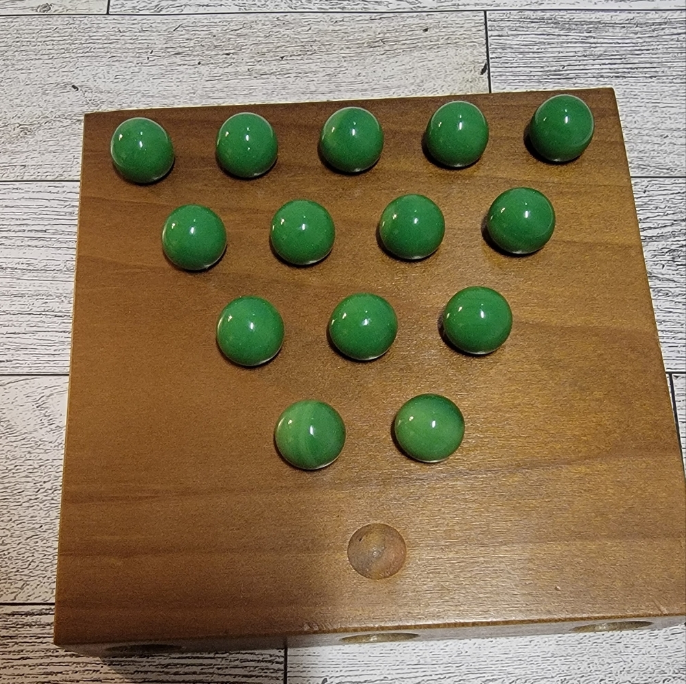 Marble Solitaire  game In A  wooden box.